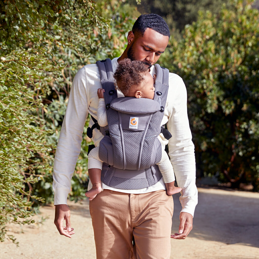 Dad wearing baby in an ERgobaby Omni Breeze baby carrier