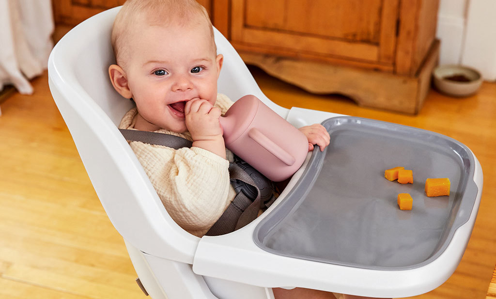 How do you introduce allergy foods to babies? Baby eating in highchair