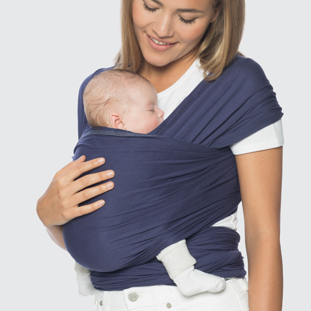 baby sleeping in a baby wrap