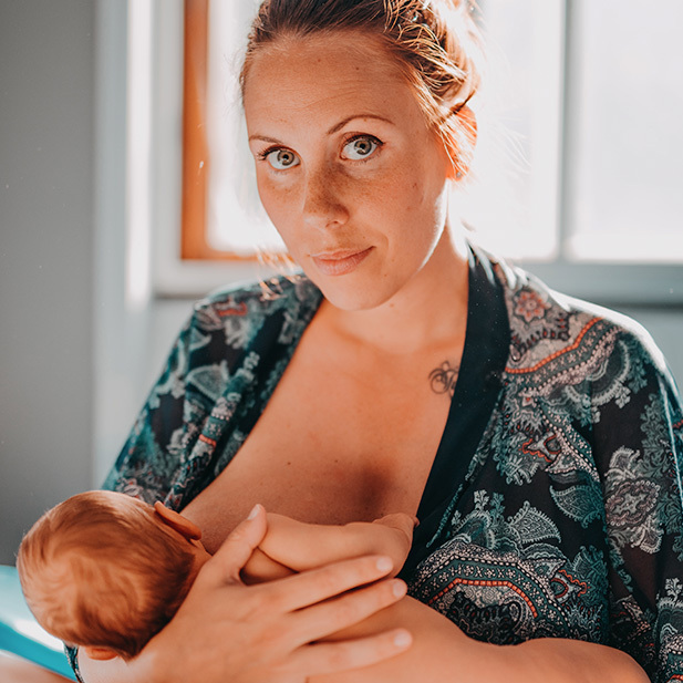 breast/chest feeding a baby