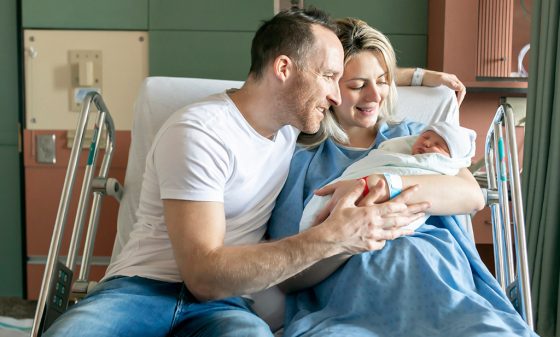 Newborn with parent in hospital