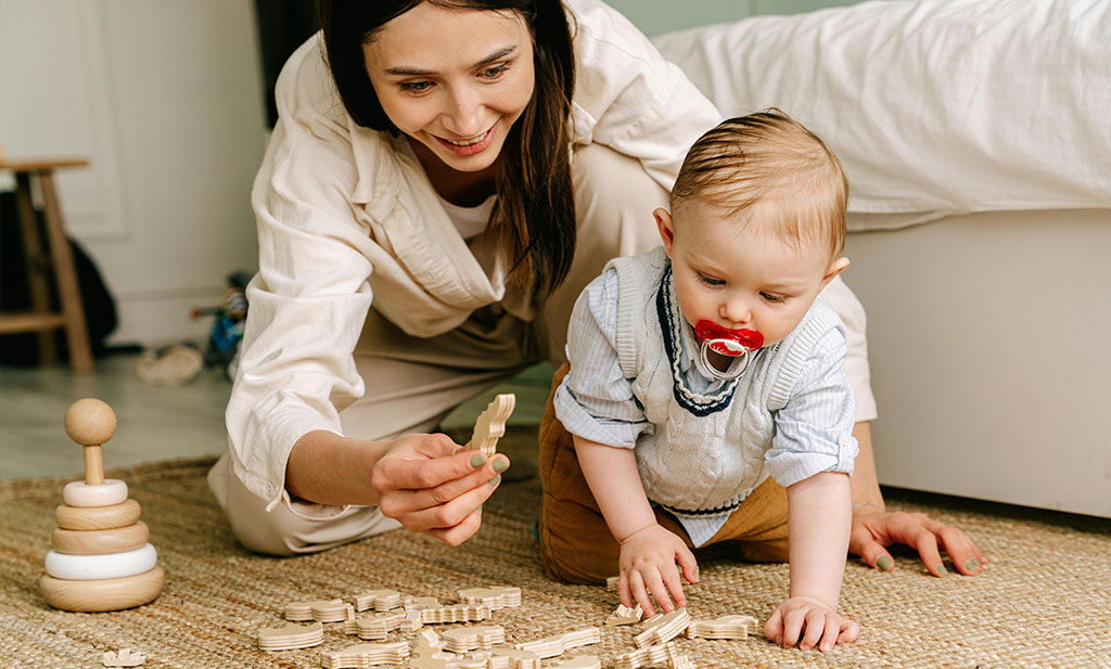 9-month-old baby development: Mom plays with baby