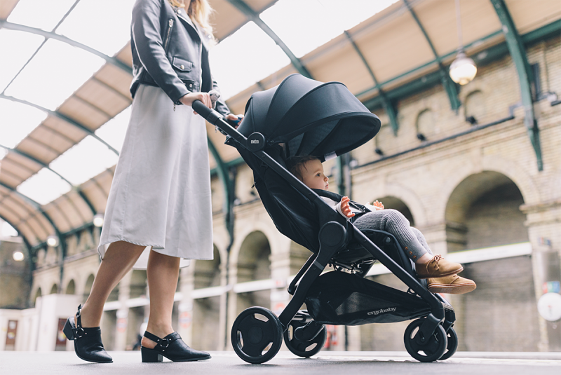 woman pushing baby in stroller