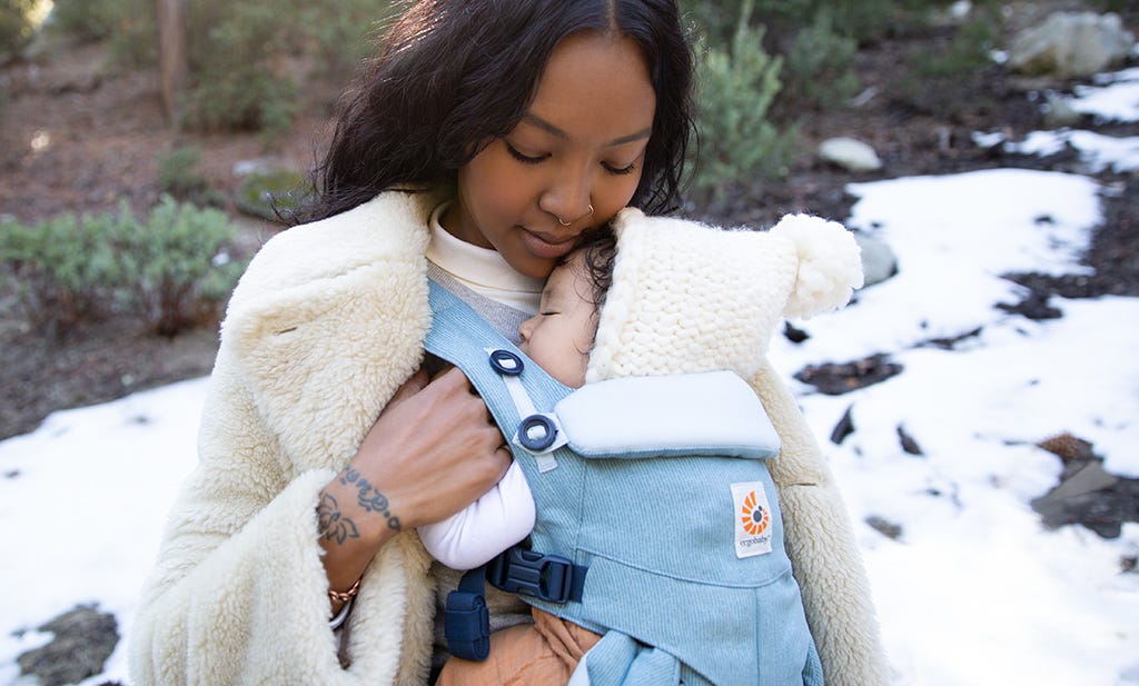 International Women's Day - Woman carryinng a baby