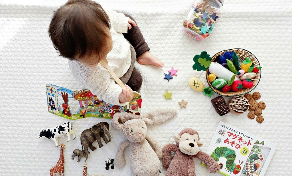 Baby with toys at</body>